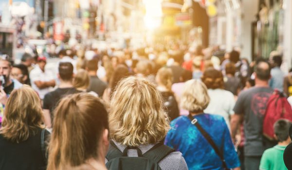 Unrecognizable mass of people walking in the city